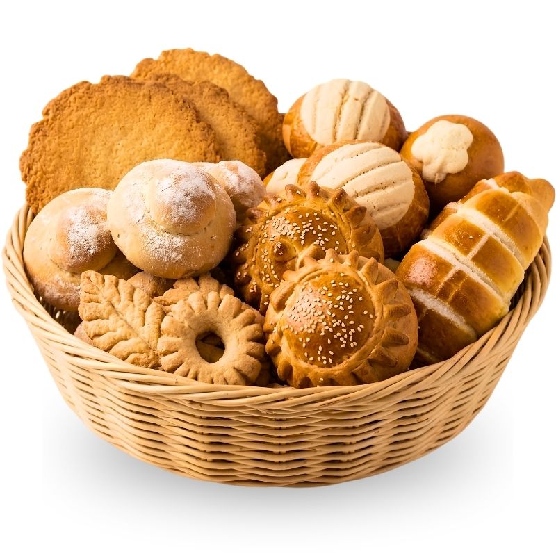 Two freshly baked Guatemalan bread loaves on a plain white background, one round with diagonal cuts and the other a long braided loaf with sesame seeds.